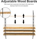 Illustratie toont 3 houten planken die aan een zwart metalen frame hangen, met pijlen die de verstelbare hoogte van de planken aangeven.
