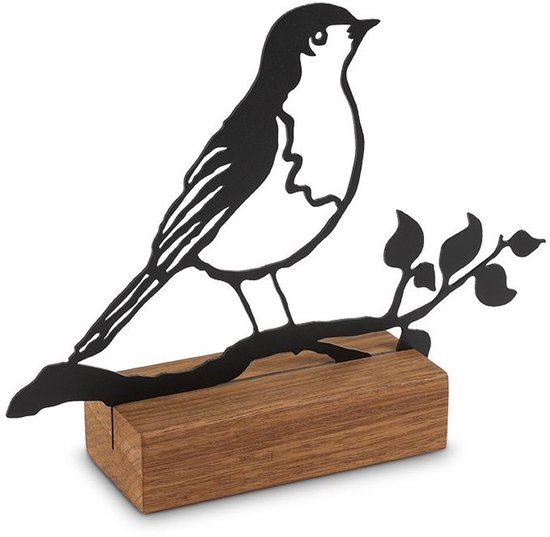 Zwart metalen silhouet van een roodborstje op een tak met bladeren, zittend op een houten voetstuk.