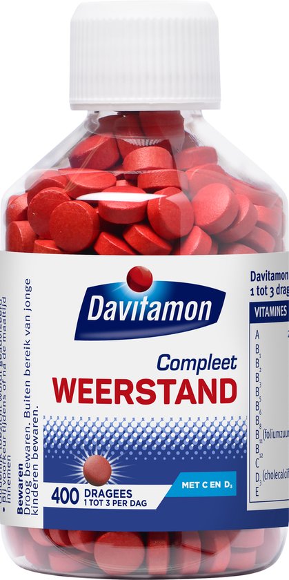 Glazen pot vol met rode Davitamon Compleet Weerstand pillen. 400 dragees. Met C en D3.