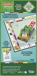 Monopoly Uitbreiding Koop Alles spelbord met spelonderdelen en familie.