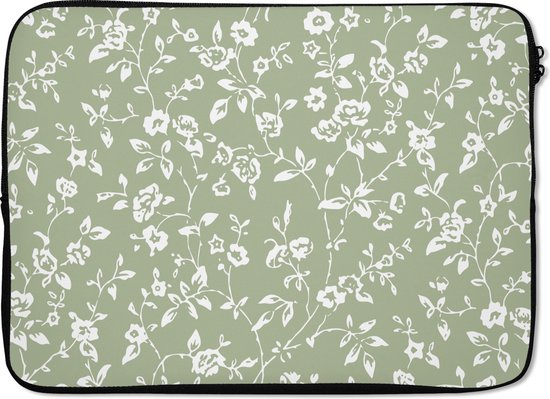 Laptophoes met een repetitief wit bloemenpatroon op een effen groene achtergrond.