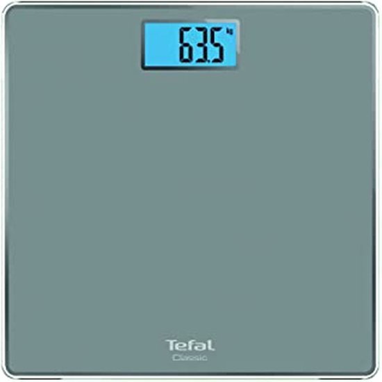 Balance Tefal grise avec un écran bleu indiquant 63,5 kg.