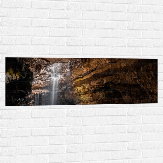 WallClassics - Muursticker - Waterval in een Grot - 120x40 cm Foto op Muursticker
