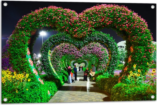 WallClassics - Tuinposter – Hartvormige Bloemenbogen in Park - 90x60 cm Foto op Tuinposter  (wanddecoratie voor buiten en binnen)
