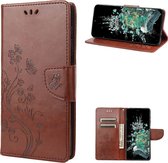 Mobigear Telefoonhoesje geschikt voor OnePlus 10T Hoesje | Mobigear Butterfly Bookcase Portemonnee | Pasjeshouder voor 3 Pasjes | Telefoonhoesje voor Pinpas / OV Kaart / Rijbewijs - Bruin
