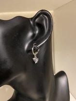 Boucles d'oreilles avec un coeur zircon
