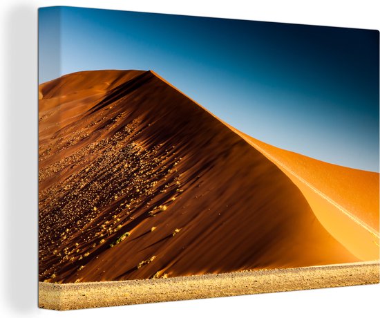 Canvas Schilderij De kleuren van de gouden duinen onder de blauwe hemel in het Namib-Naukluft park - 30x20 cm - Wanddecoratie