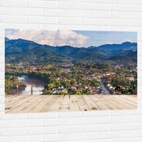 Muursticker - Uitzicht over Dorpje aan de Rand van Berg in Laos - 120x80 cm Foto op Muursticker