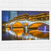 Muursticker - Verlichte Anshun Brug in de Avond in Chengdu, China - 75x50 cm Foto op Muursticker