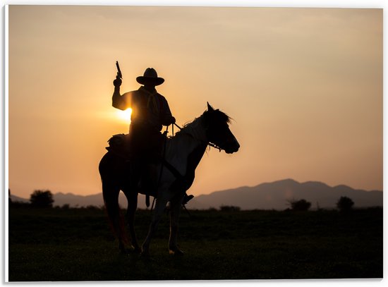 PVC Schuimplaat - Zonsondergang achter Cowboy op Bruin met Wit Paard met Geweer - 40x30 cm Foto op PVC Schuimplaat (Met Ophangsysteem)