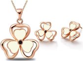 Fashionidea - Mooie goudkleurige klavertjes ketting en oorbellen met witte details.