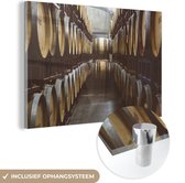 MuchoWow® Glasschilderij 180x120 cm - Schilderij acrylglas - Een gangpad van wijnvaten - Foto op glas - Schilderijen