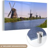 MuchoWow® Glasschilderij 40x20 cm - Schilderij acrylglas - Nederland - Molen - Water - Foto op glas - Schilderijen