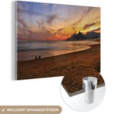 MuchoWow® Glasschilderij 180x120 cm - Schilderij acrylglas - Het Zuid-Amerikaanse Ipanema-strand in Brazilië bij zonsondergang - Foto op glas - Schilderijen