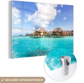 MuchoWow® Glasschilderij 120x80 cm - Schilderij acrylglas - De boven het water hangende bungalows op Bora Bora - Foto op glas - Schilderijen