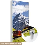 MuchoWow® Glasschilderij 20x40 cm - Schilderij acrylglas - Een rode trein met bergen op de achtergrond - Foto op glas - Schilderijen