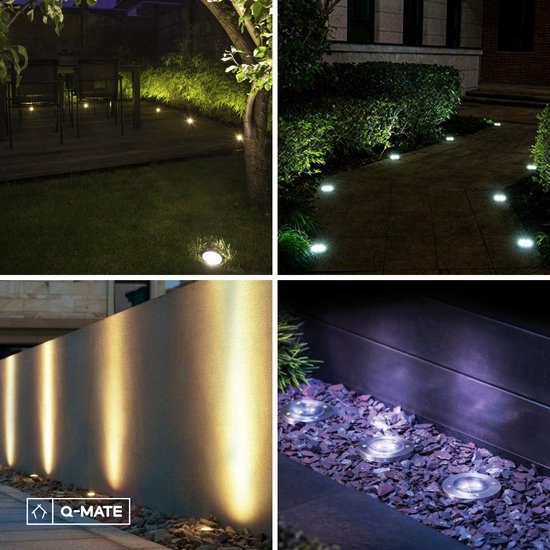 Éclairage de jardin décoratif avec des spots de sol près d'un arbre, sur un chemin, le long d'un mur et dans des graviers.
