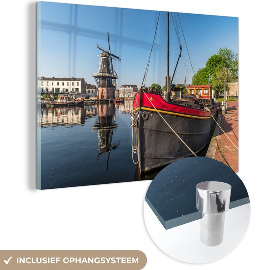 MuchoWow® Glasschilderij 120x80 cm - Schilderij acrylglas - Haarlem - Boot - Molen - Foto op glas - Schilderijen