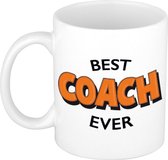 Best coach ever cadeau mok / beker wit met oranje cartoon letters - 300 ml - keramiek - verjaardag - bedankje coach / begeleider / trainer