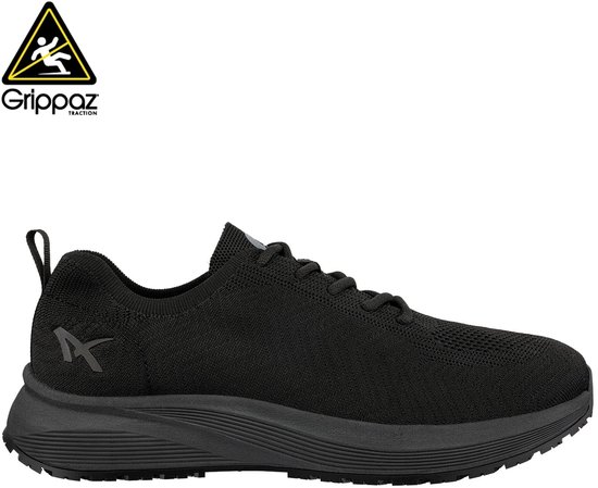 Zwarte sneaker met grijze logo 'X' en gele waarschuwingsdriehoek met 'Grippaz' logo.