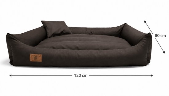 Bruine hondenmand, 120 cm lang en 80 cm breed, met een los kussen aan de zijkant. De mand heeft opstaande, zachte randen.