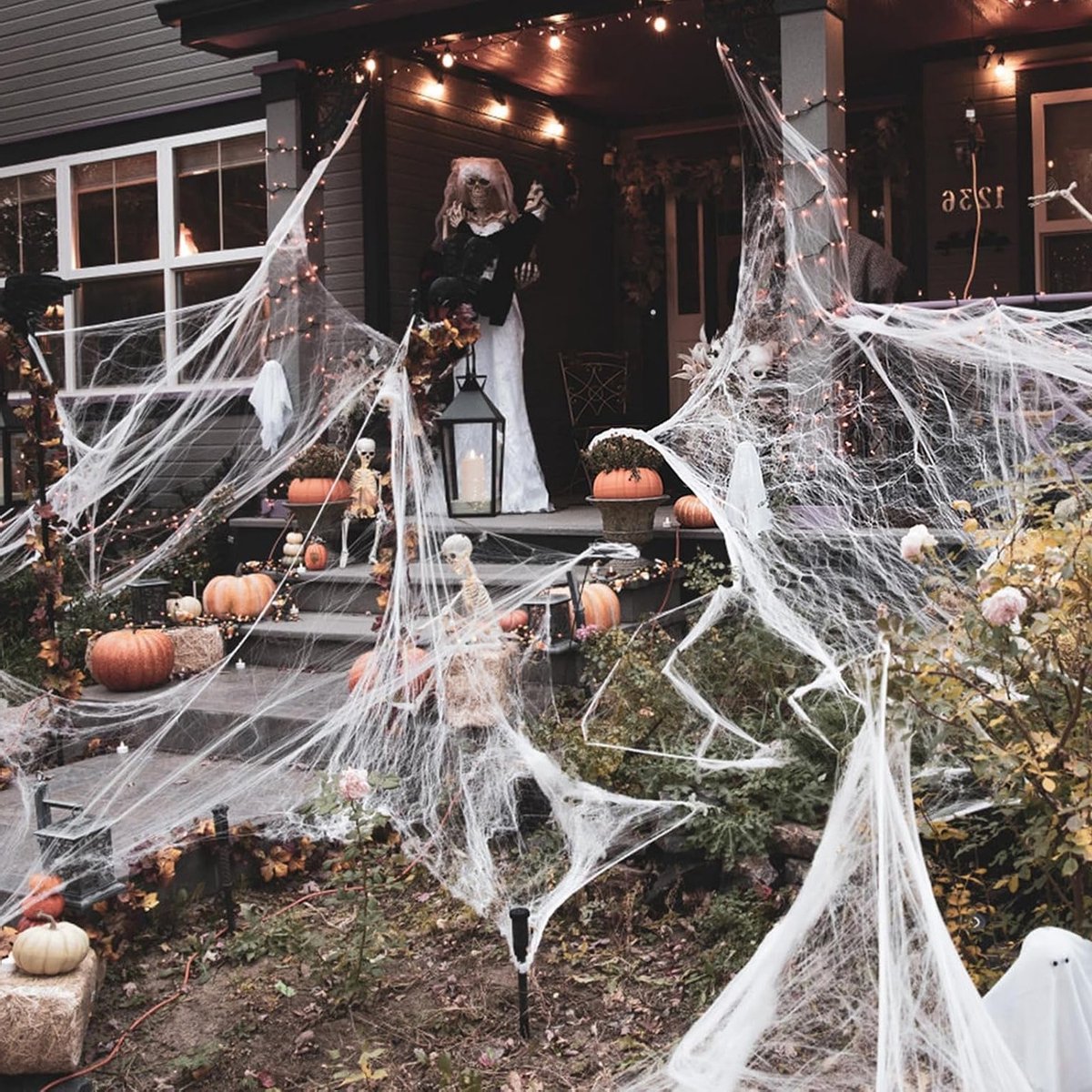 Halloween decoratie spinnenweb met 50 kunstspinnen - Voor binnen en buiten