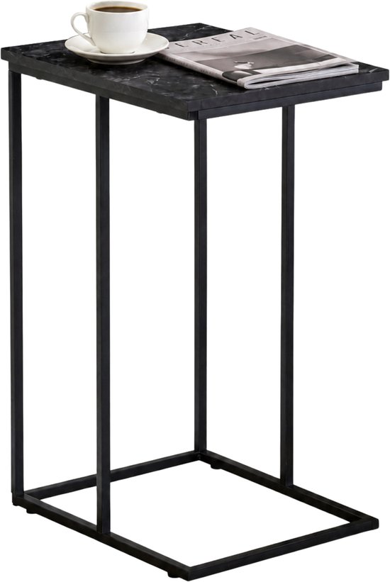 Table d'appoint noire avec plateau aspect marbre, une tasse de café et un magazine.
