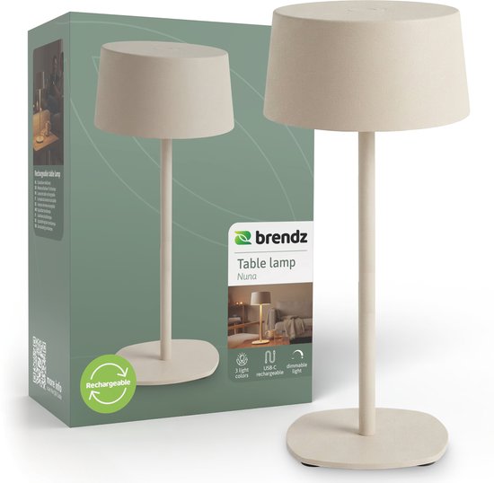 De beige draadloze Nuna tafellamp van Brendz, USB-C oplaadbaar met 3 lichtkleuren en dimbaar, naast de verpakking.