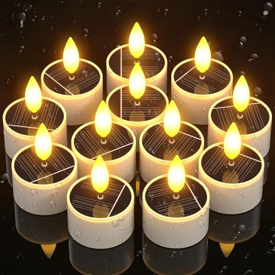 Twaalf witte zonne-theelichten met vlamvormige gele LED's, gerangschikt in een cirkel op een donkere ondergrond.