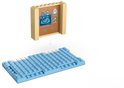 Jouet scanner à rayons X LEGO avec un cochon d'Inde sur une base de construction bleue.