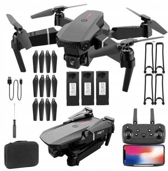 Grijze opvouwbare drone met 4 extra propellers, 3 accu's, een controller en opbergtas.