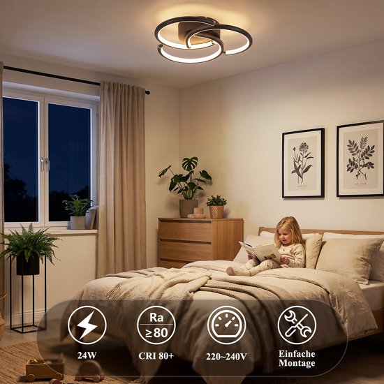 Meisje leest in een slaapkamer verlicht door een moderne zwarte plafondlamp.