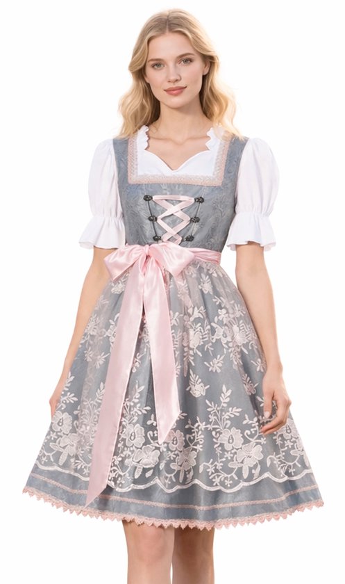 Mannequin en dirndl gris avec bordures en dentelle rose, laçage et nœud. Avec chemisier blanc à manches bouffantes.