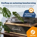 Platenspeler met een ingebouwde stofkap en een deel van een plant.