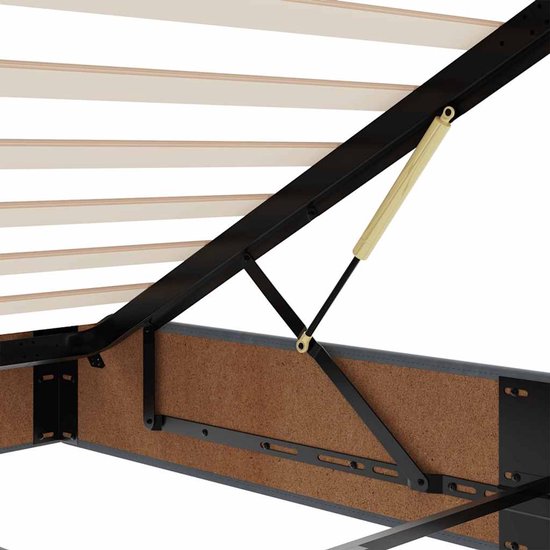 Close-up van de scharnierende metalen liftconstructie en houten latten van het donkergrijze bedframe.