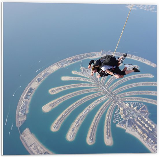 PVC Schuimplaat - Parachutespringer boven de Palm van Dubai - 50x50 cm Foto op PVC Schuimplaat (Met Ophangsysteem)