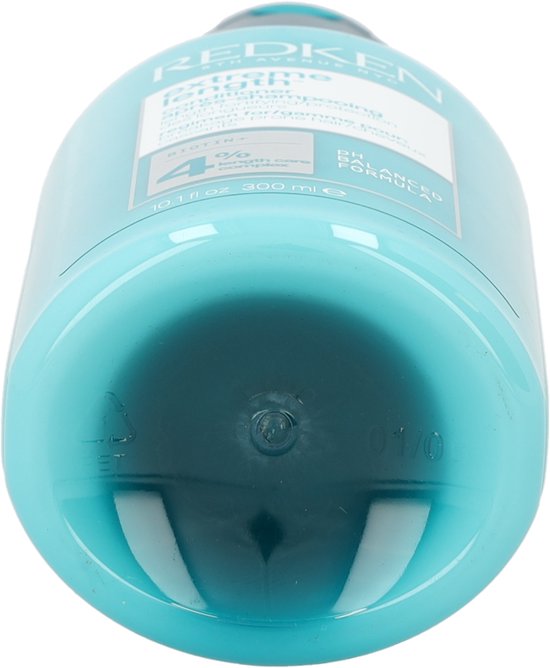 Onderkant van een aquafl fles Redken Extreme Length conditioner.