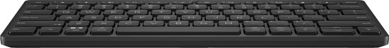 Clavier Bluetooth HP compact noir sur fond noir, vue de côté.