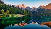 Fotobehang Calm Morning View Of Fusine Lake. Colorful Summer Sunrise In Julian Alps With Mangart Peak On Background, Province Of Udine, Italy, Europe. Beauty Of Nature Concept Background. - Vliesbehang - 416 x 290 cm