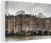 Canvas Schilderij Amsterdamse gracht in de winter - 30x20 cm - Wanddecoratie