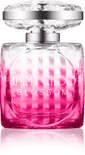 Roze Jimmy Choo Blossom parfumfles tegen een zwarte achtergrond.