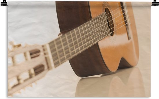 Wandkleed Akoestische gitaar - Een Akoestische gitaar ligt op de zij Wandkleed katoen 150x100 cm - Wandtapijt met foto