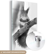 MuchoWow® Glasschilderij 120x180 cm - Schilderij acrylglas - Een eekhoorn in de winter op een tak - zwart wit - Foto op glas - Schilderijen