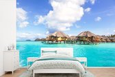 Behang - Fotobehang De boven het water hangende bungalows op Bora Bora - Breedte 360 cm x hoogte 240 cm