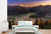 Behang - Fotobehang Zonsondergang bij Zwitserse stad Interlaken - Breedte 450 cm x hoogte 300 cm