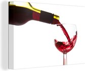 Canvas Schilderij Rode wijn die in een wijnglas wordt gegoten - 30x20 cm - Wanddecoratie