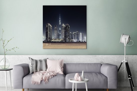 Canvas schilderij 90x90 cm - Wanddecoratie De Burj Khalifa verlicht met andere wolkenkrabbers de lucht boven Dubai - Muurdecoratie woonkamer - Slaapkamer decoratie - Kamer accessoires - Schilderijen op canvas