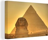 Canvas schilderij 140x90 cm - Wanddecoratie De sfinx van Giza in Egypte bij avondlicht - Muurdecoratie woonkamer - Slaapkamer decoratie - Kamer accessoires - Schilderijen