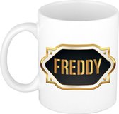 Freddy naam cadeau mok / beker met gouden embleem - kado verjaardag/ vaderdag/ pensioen/ geslaagd/ bedankt