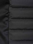 Detail van de zijkant van een zwarte, gewatteerde bodywarmer voor dames van Bjørnson met rits.